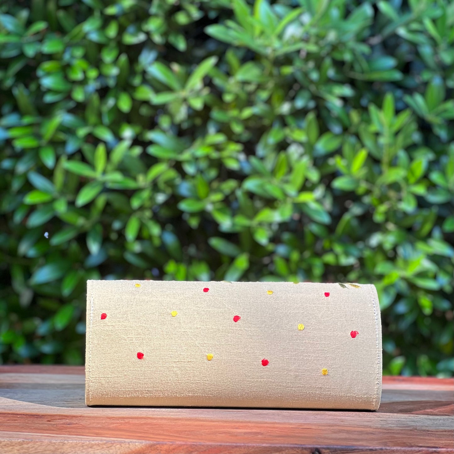 Embroidered clutch