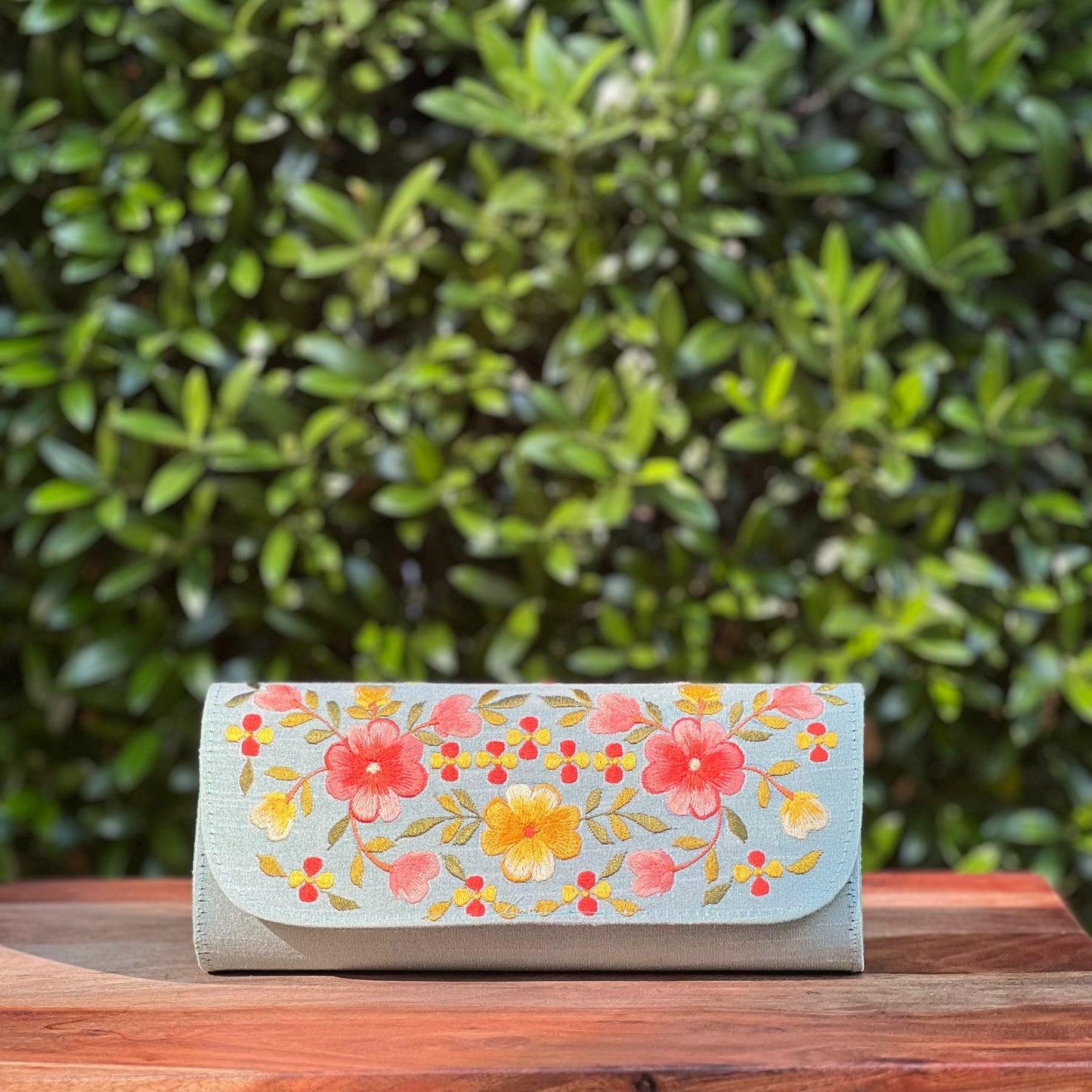 Embroidered clutch