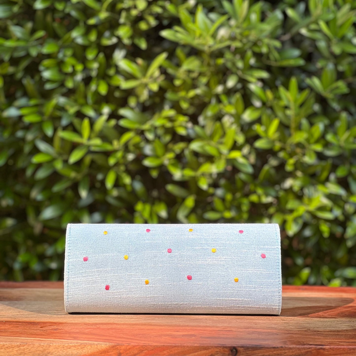 Embroidered clutch