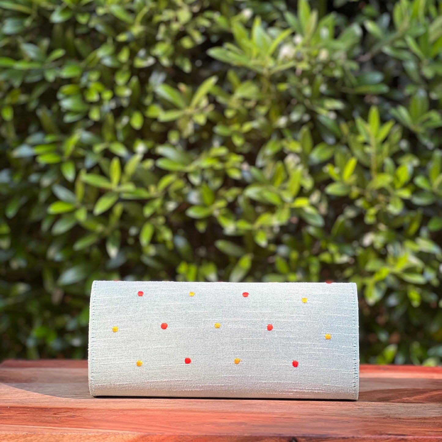 Embroidered clutch