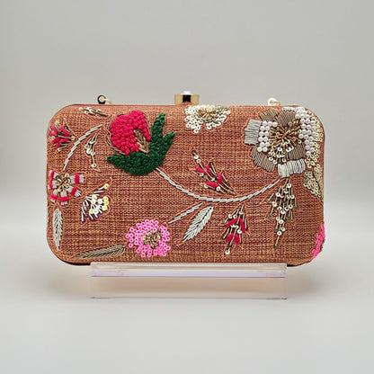 Zardozi and Dabka hand work classic clutch in Roasted Pecan color.  The bag also features a detachable chain so that it can be worn on the shoulder as a sling.