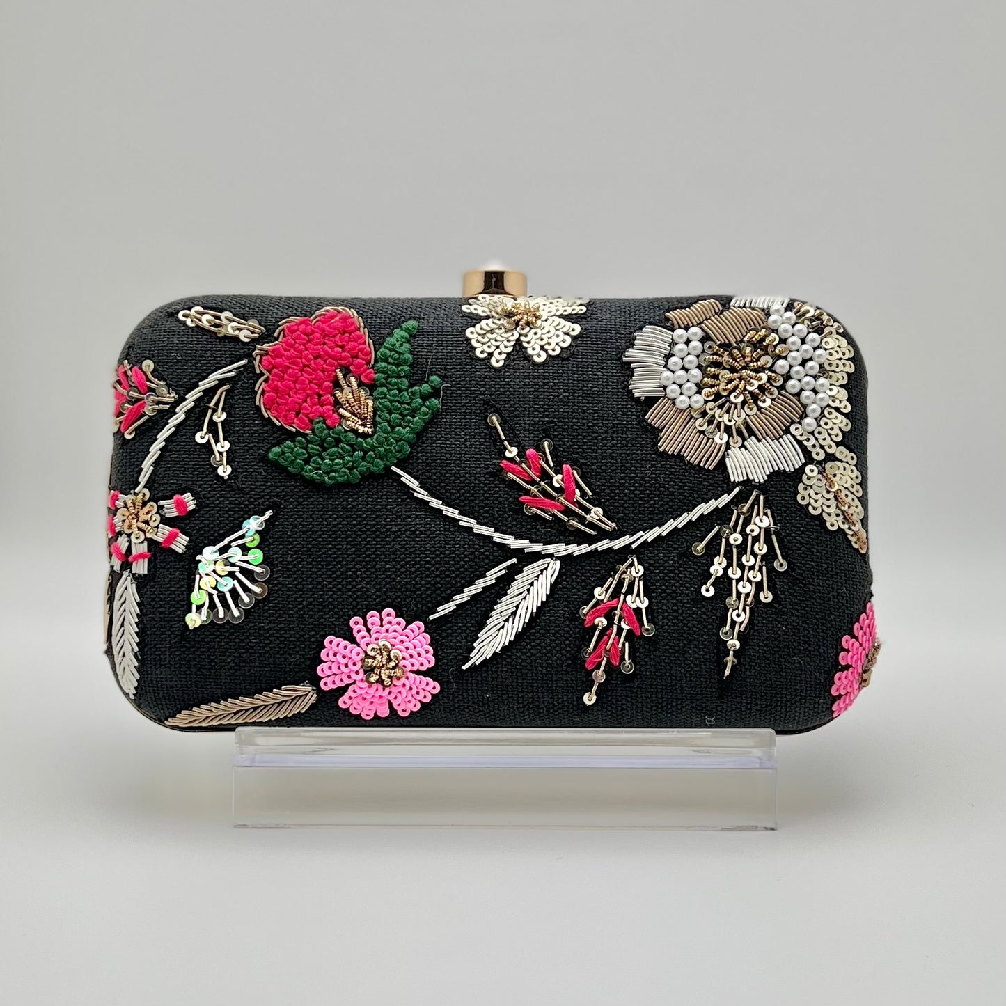 Zardozi and Dabka hand work classic clutch in black wash color. The bag also features a detachable chain so that it can be worn on the shoulder as a sling.
